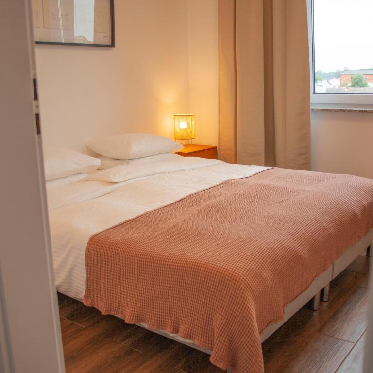Posteľ alebo postele v izbe v ubytovaní Przytulny Apartament Mickiewicza 14 4