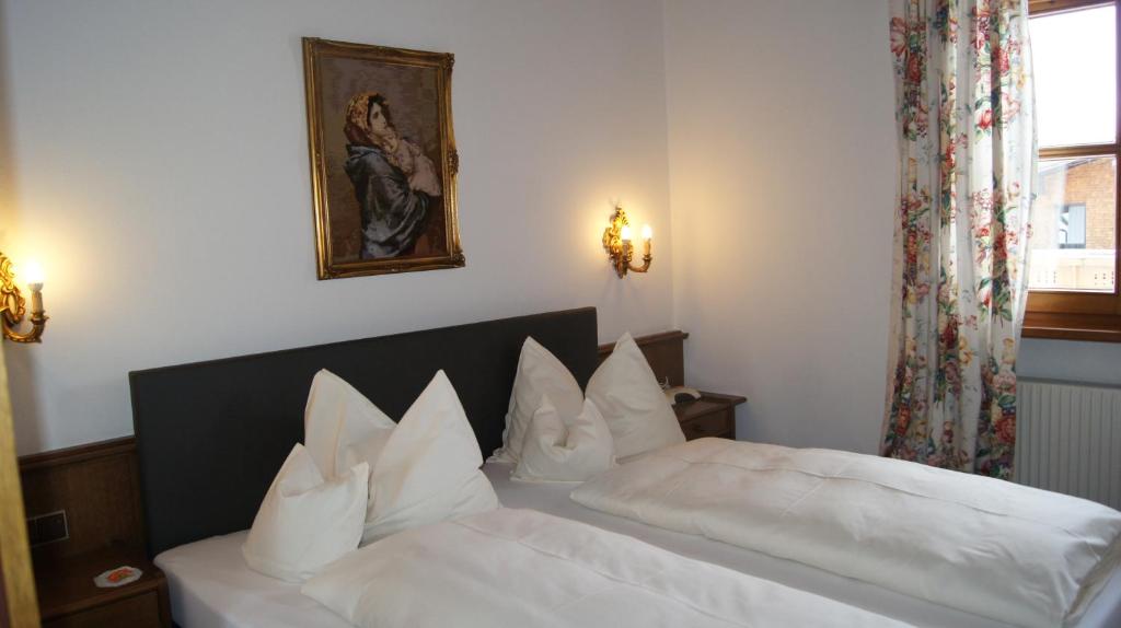 Postel nebo postele na pokoji v ubytování Hotel Hartenfels