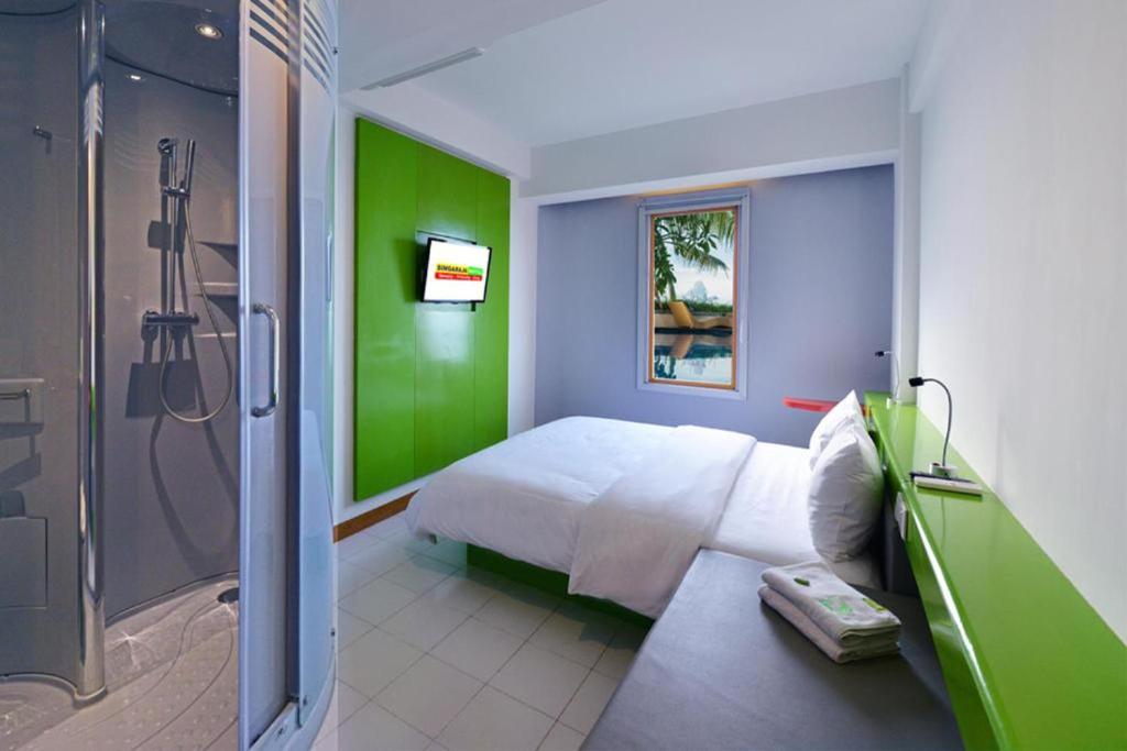 Postel nebo postele na pokoji v ubytování Singaraja Hotel - CHSE Certified