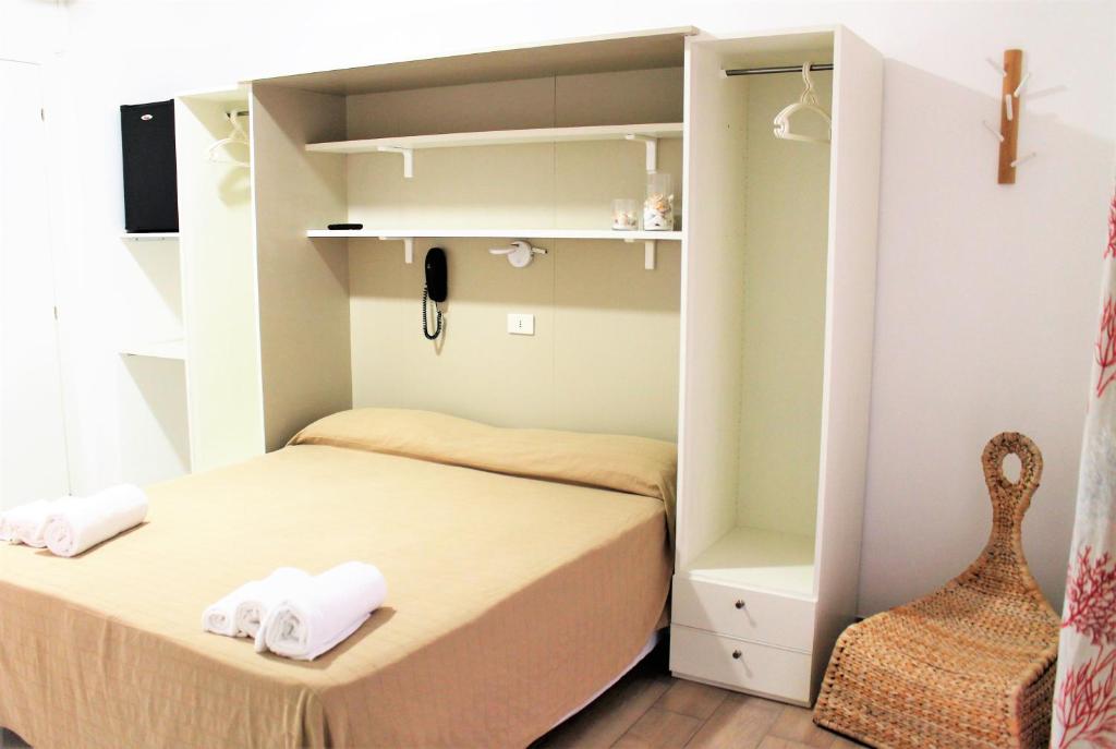 Postel nebo postele na pokoji v ubytování Hotel Villa Susy