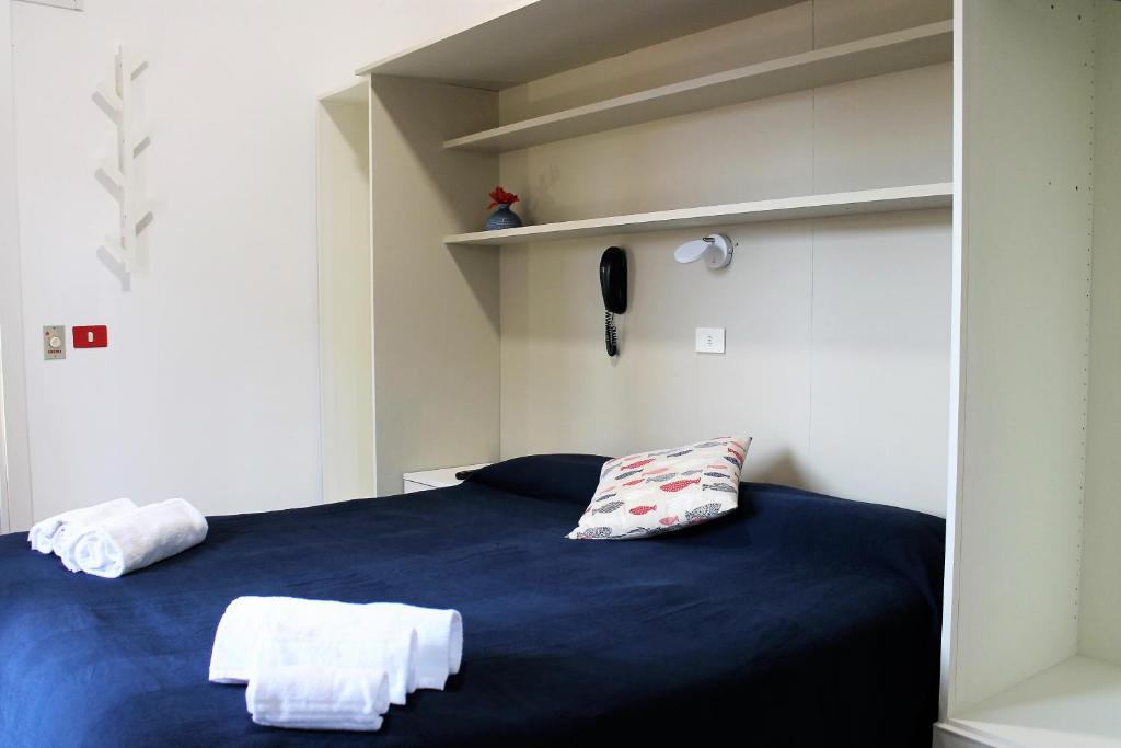 Postel nebo postele na pokoji v ubytování Hotel Villa Susy