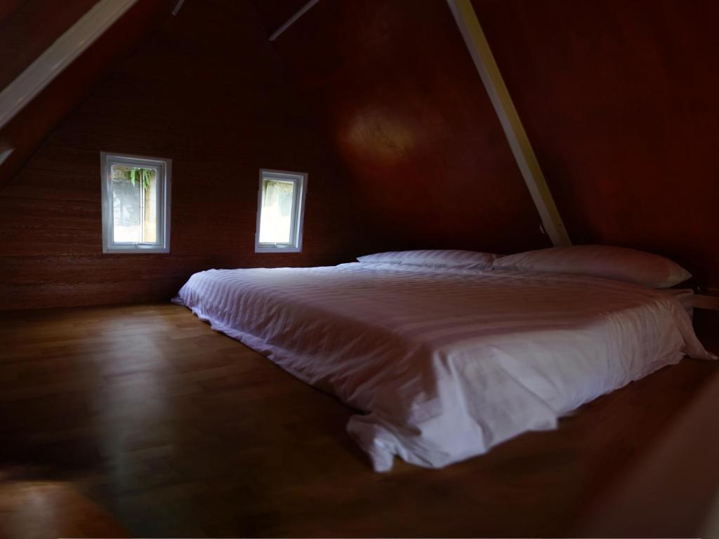 Postel nebo postele na pokoji v ubytování GSV Cottage Sharia