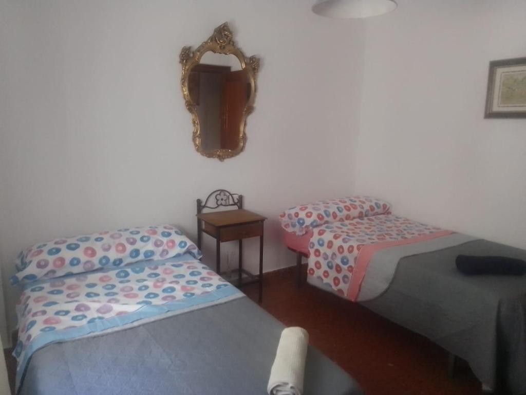 Postel nebo postele na pokoji v ubytování Victoria