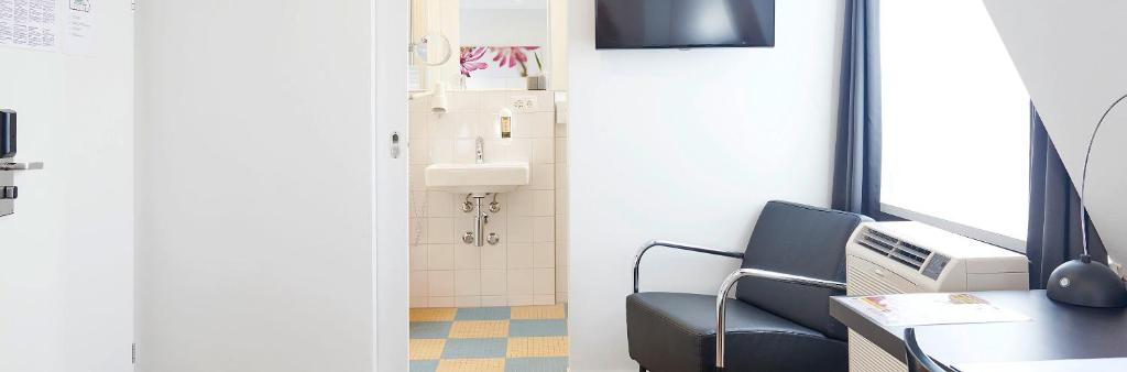 TV a/nebo společenská místnost v ubytování Hotel Hottingen