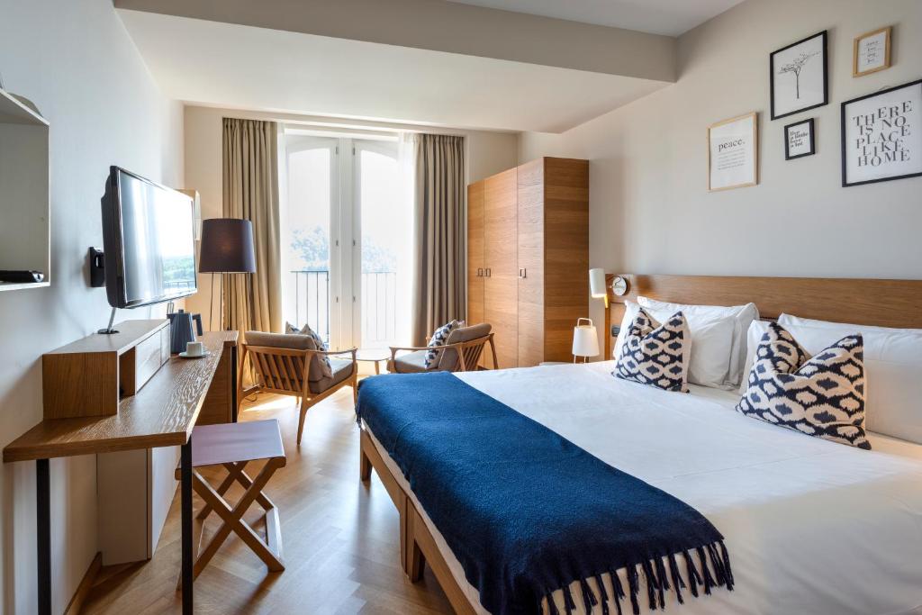 Postel nebo postele na pokoji v ubytování Hotel de Charme Laveno - Luxury all Inclusive