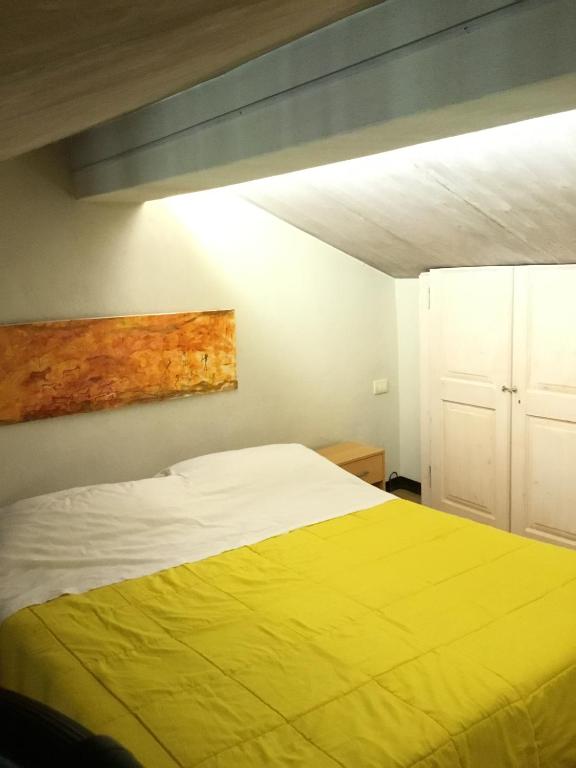 Postel nebo postele na pokoji v ubytování New Arcobaleno Ossegna