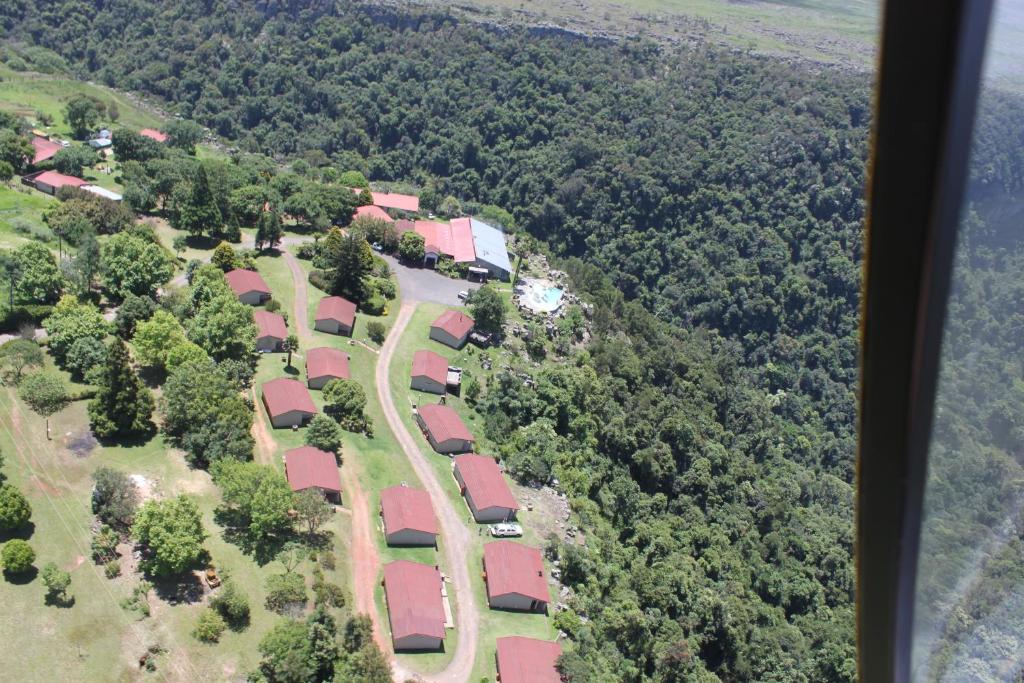 an aerial view of a group of houses and trees at Panorama Chalets & Rest Camp in Graskop