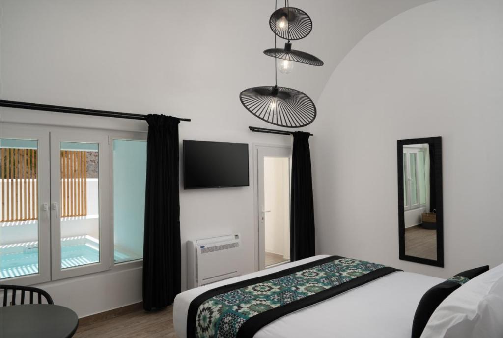 Krevet ili kreveti u jedinici u okviru objekta Allegro Suites Oia