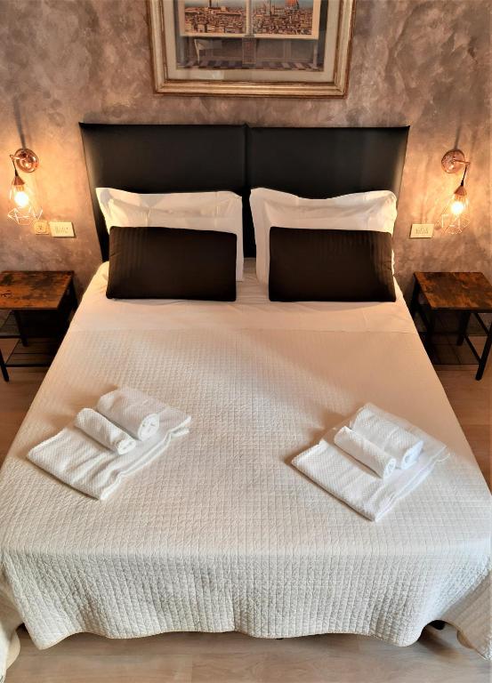 Postel nebo postele na pokoji v ubytování Hotel Victoria