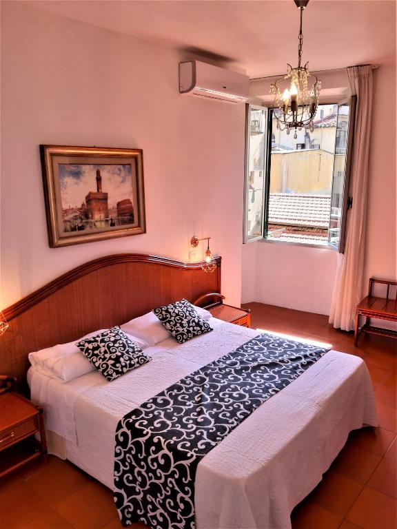 Postel nebo postele na pokoji v ubytování Hotel Victoria