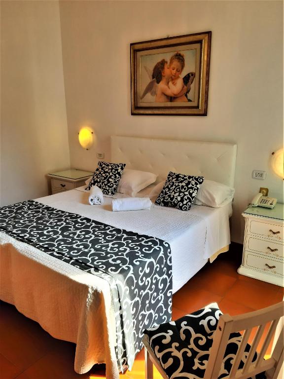 Postel nebo postele na pokoji v ubytování Hotel Victoria