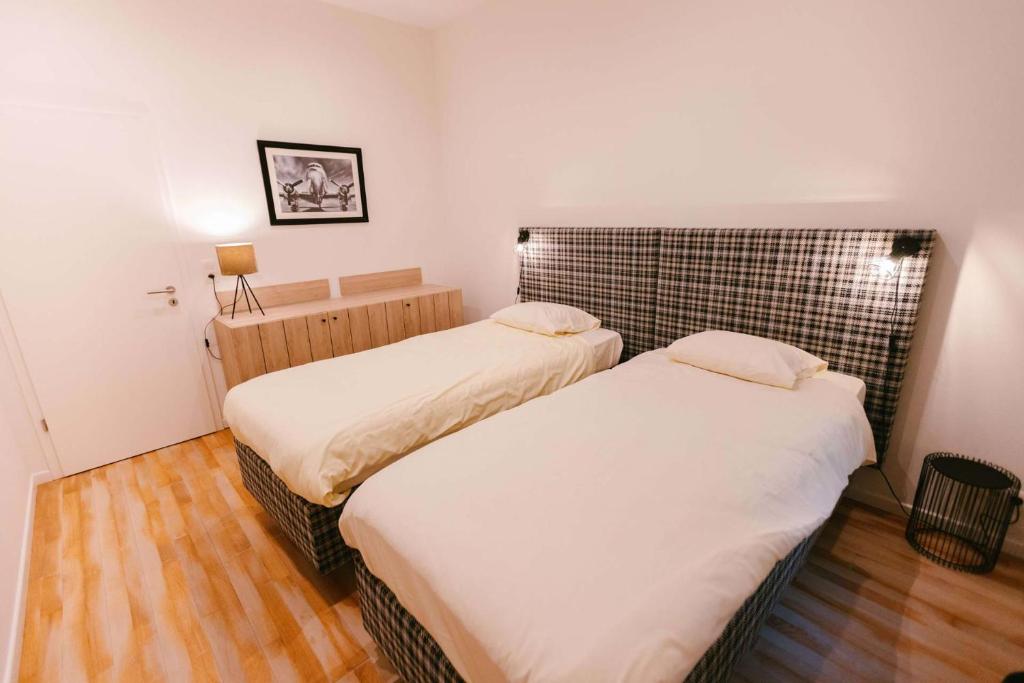 Postel nebo postele na pokoji v ubytování Hotel Le Val D'arimont