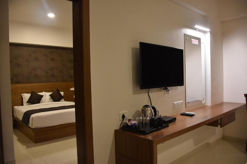 TV a/nebo společenská místnost v ubytování Heritage Inn