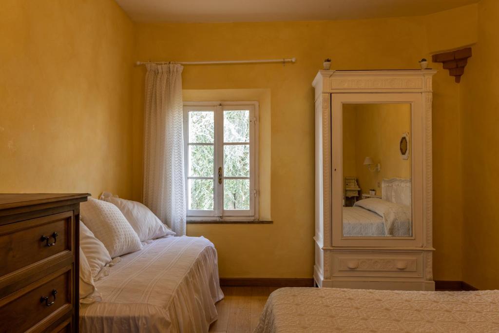 Postel nebo postele na pokoji v ubytování Agriturismo Percenna