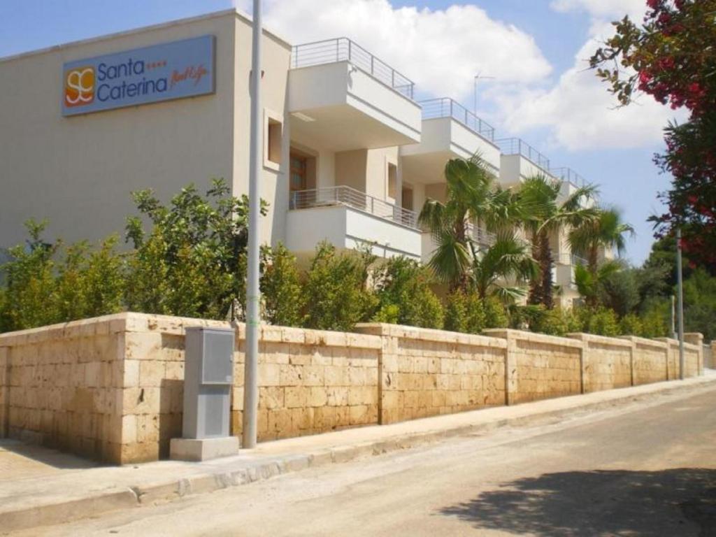 a building on the side of a street at Santa Caterina Resort in Santa Caterina di Nardò