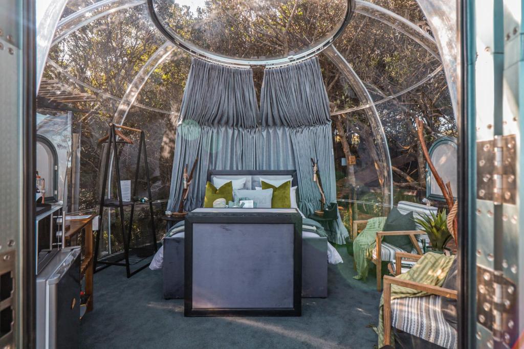 a room with a bed and an arched ceiling at The Dome - Misty Mountain Reserve in Thornham