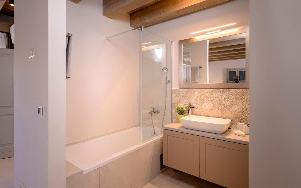 a bathroom with a sink and a glass shower at Villa Zanino in Veliko Grablje