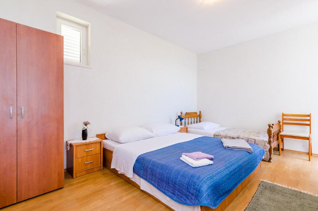 Posteľ alebo postele v izbe v ubytovaní Apartments Glavor