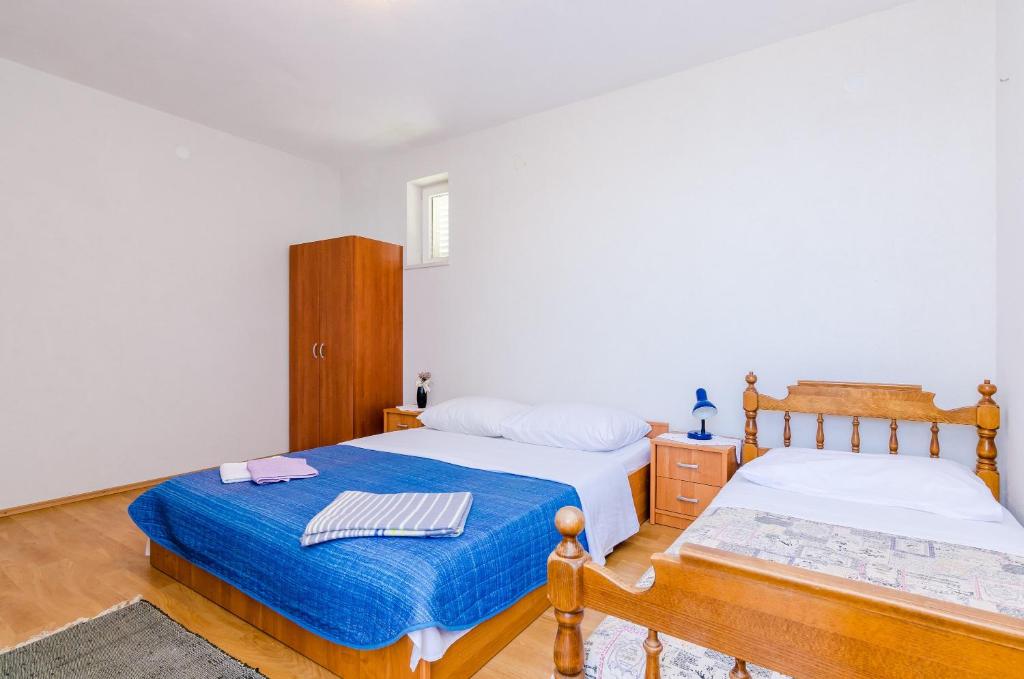 Posteľ alebo postele v izbe v ubytovaní Apartments Glavor