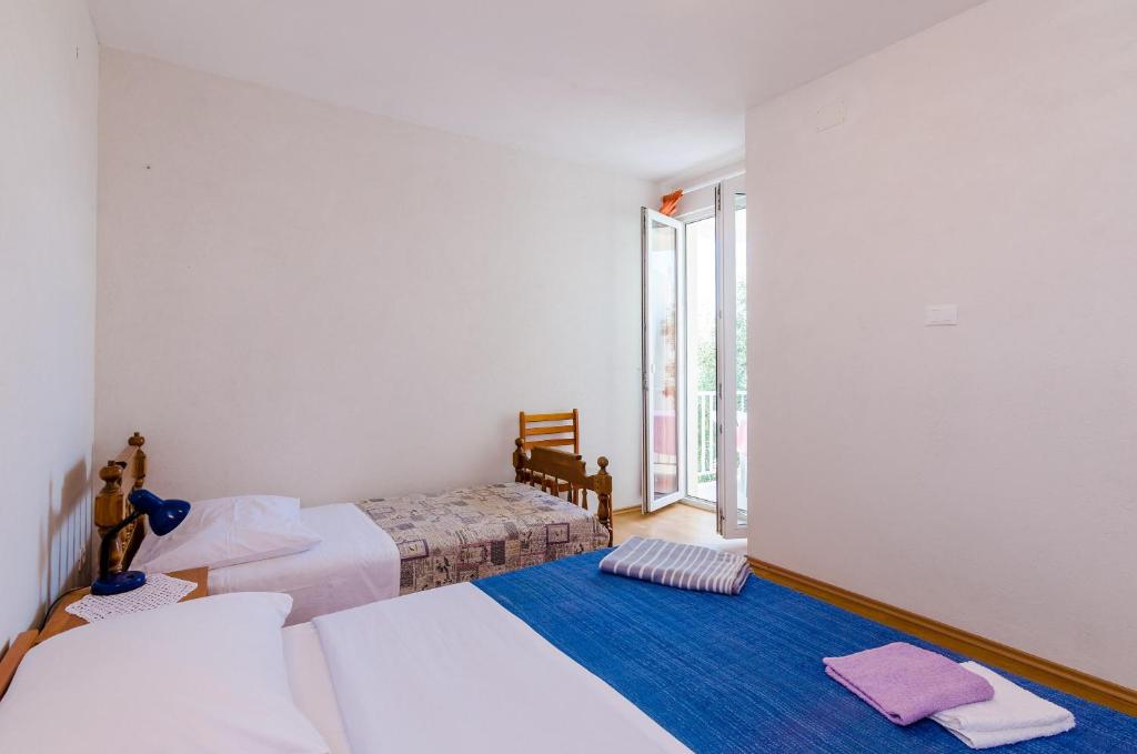 Posteľ alebo postele v izbe v ubytovaní Apartments Glavor