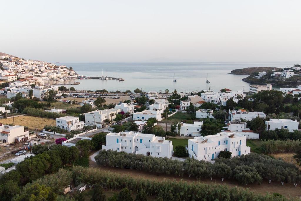 an aerial view of a white city and the ocean at Likio Studios in Batsi