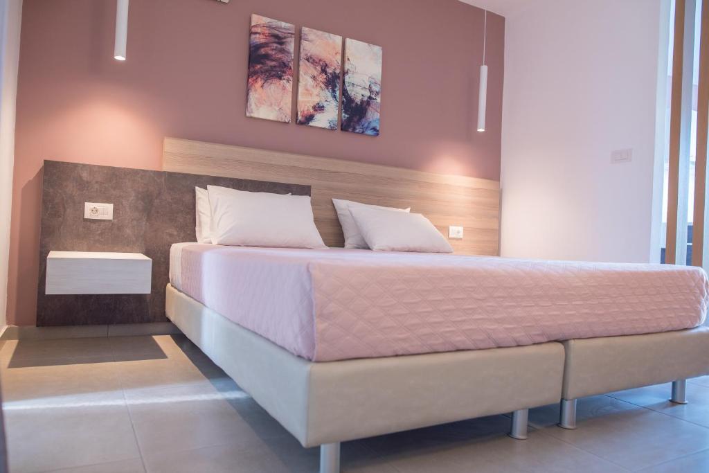 Postel nebo postele na pokoji v ubytování Gelli Apartments