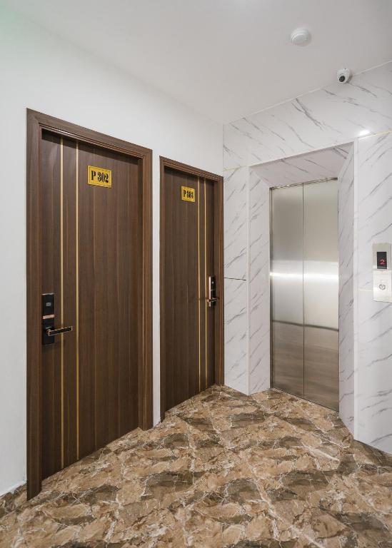 Postel nebo postele na pokoji v ubytování Wind Hotel