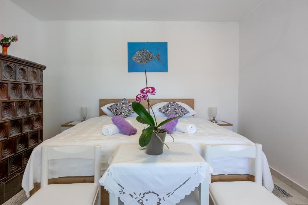 Postel nebo postele na pokoji v ubytování Holiday House Julija