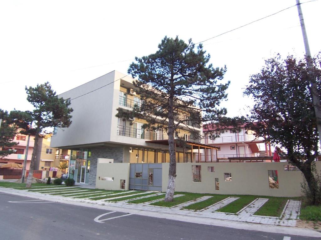 a building on the side of a street at Tuya Residence in Eforie Nord