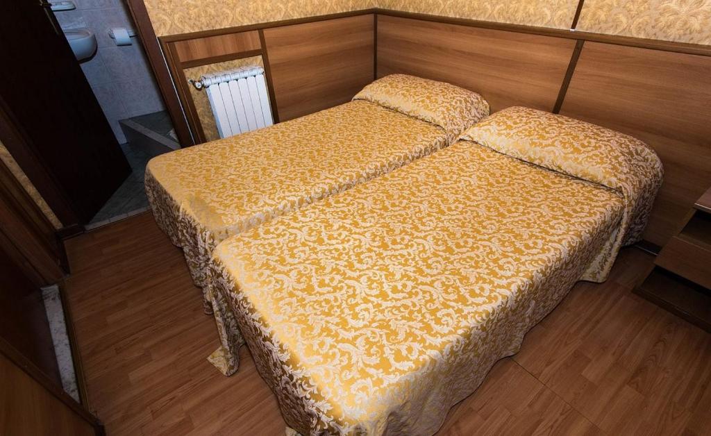 Postel nebo postele na pokoji v ubytování Hotel Artromano
