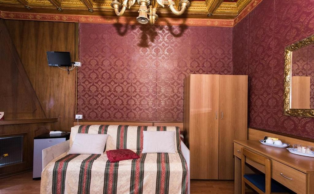 Postel nebo postele na pokoji v ubytování Hotel Artromano