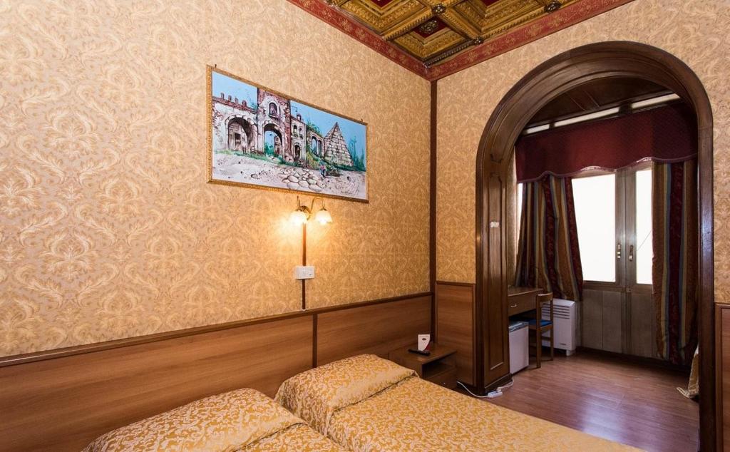 Postel nebo postele na pokoji v ubytování Hotel Artromano