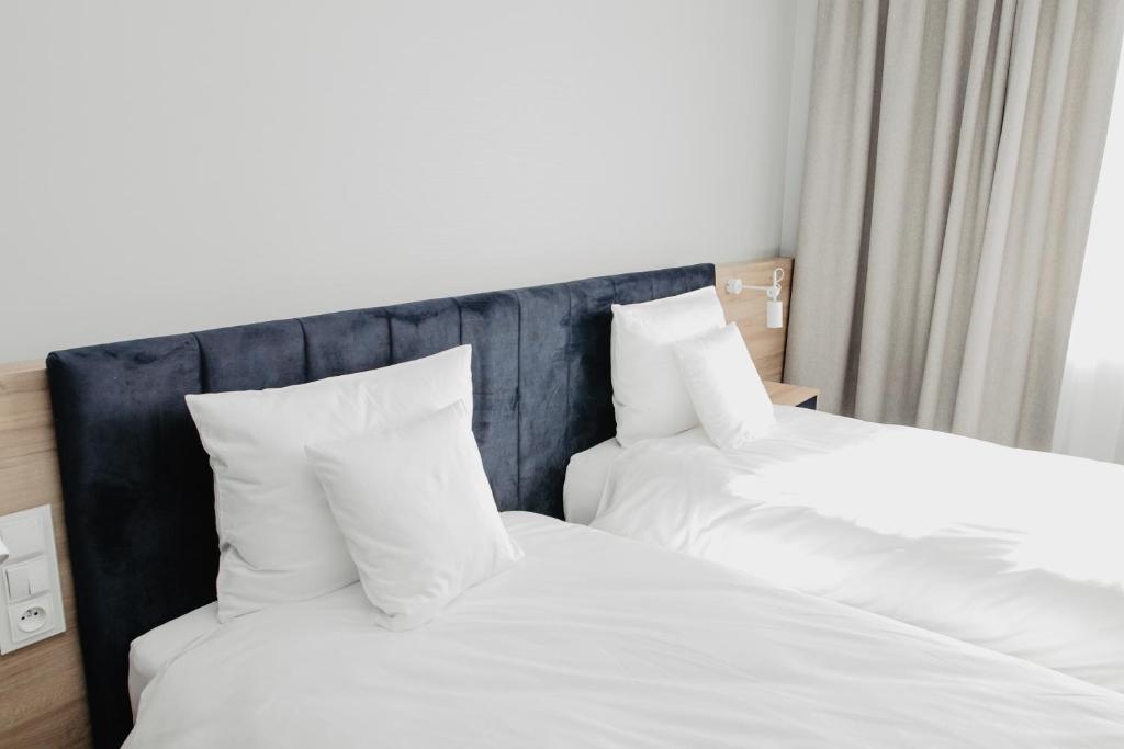 Posteľ alebo postele v izbe v ubytovaní Molto Bene Hotel & Restaurant