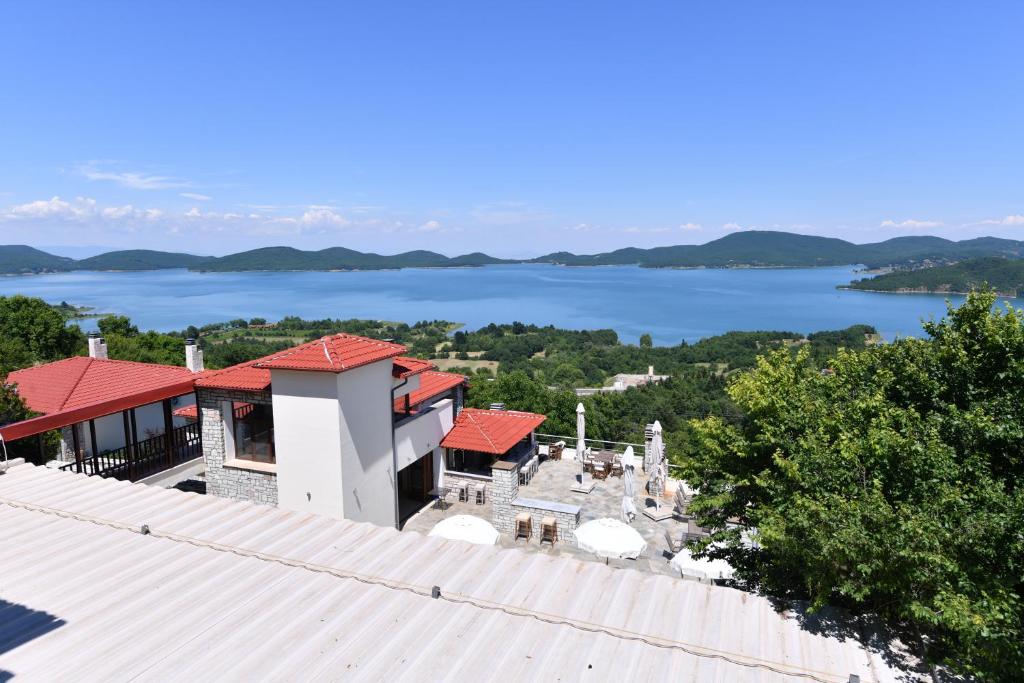 arial view of a building with a lake in the background at Nevros Hotel Resort and Spa in Neochori