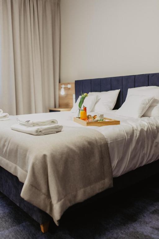 Posteľ alebo postele v izbe v ubytovaní Molto Bene Hotel & Restaurant