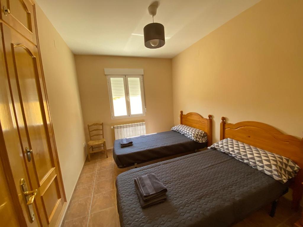 Postel nebo postele na pokoji v ubytování El Rincón de Dorotea - Casa rural