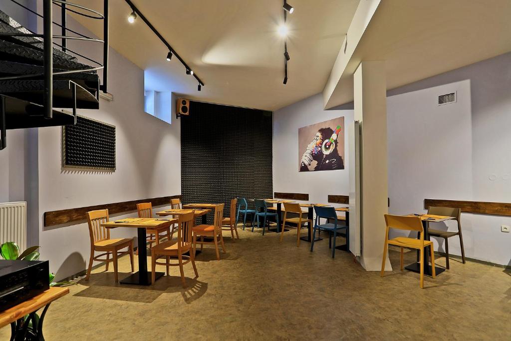 a dining room with wooden tables and chairs at Hotel Pilgrim in Karlovy Vary