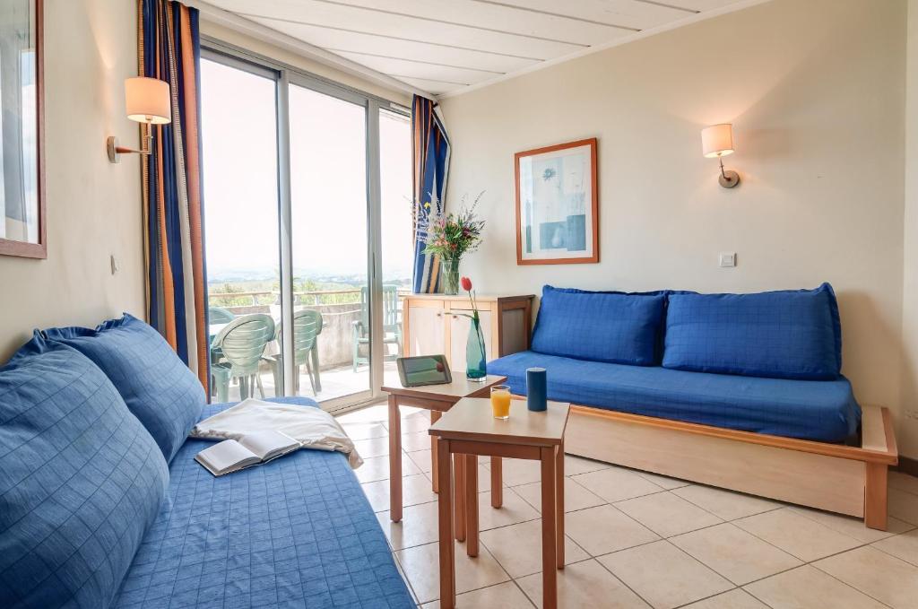 Posezení v ubytování SOWELL HOTELS Ardèche