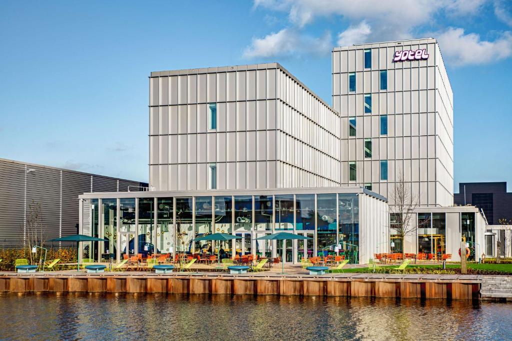 a large building with a lot of windows on it at YOTEL Amsterdam in Amsterdam