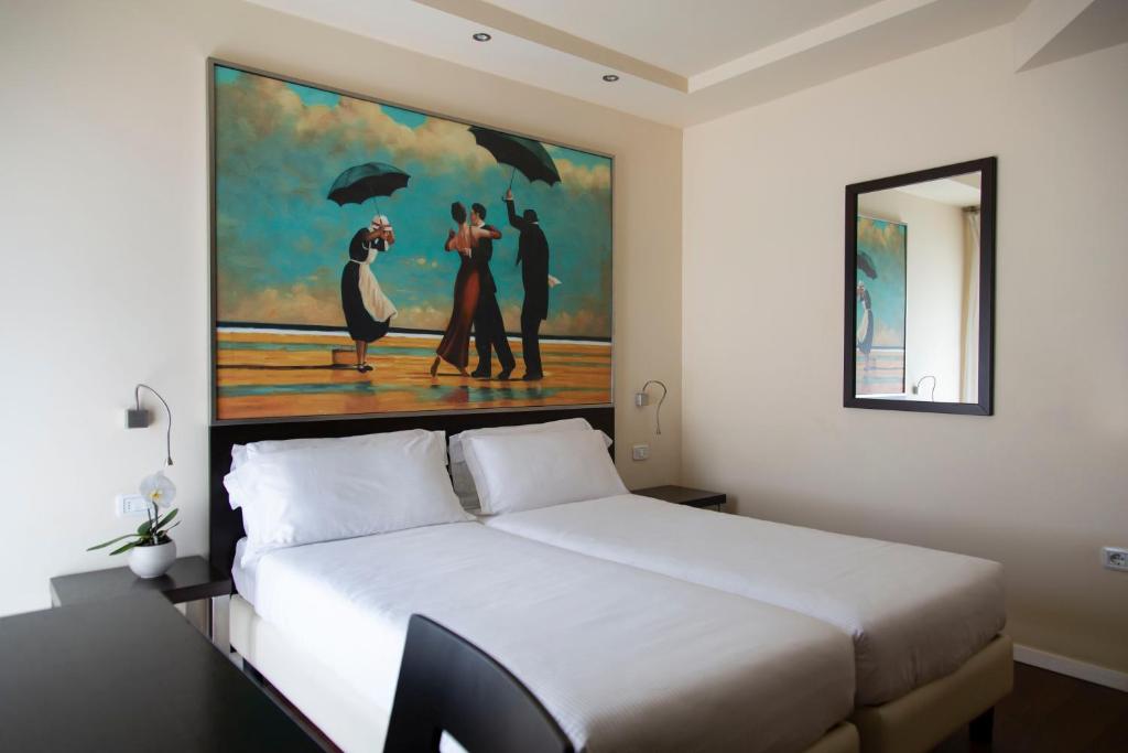 Postel nebo postele na pokoji v ubytování Hotel Antico Borgo