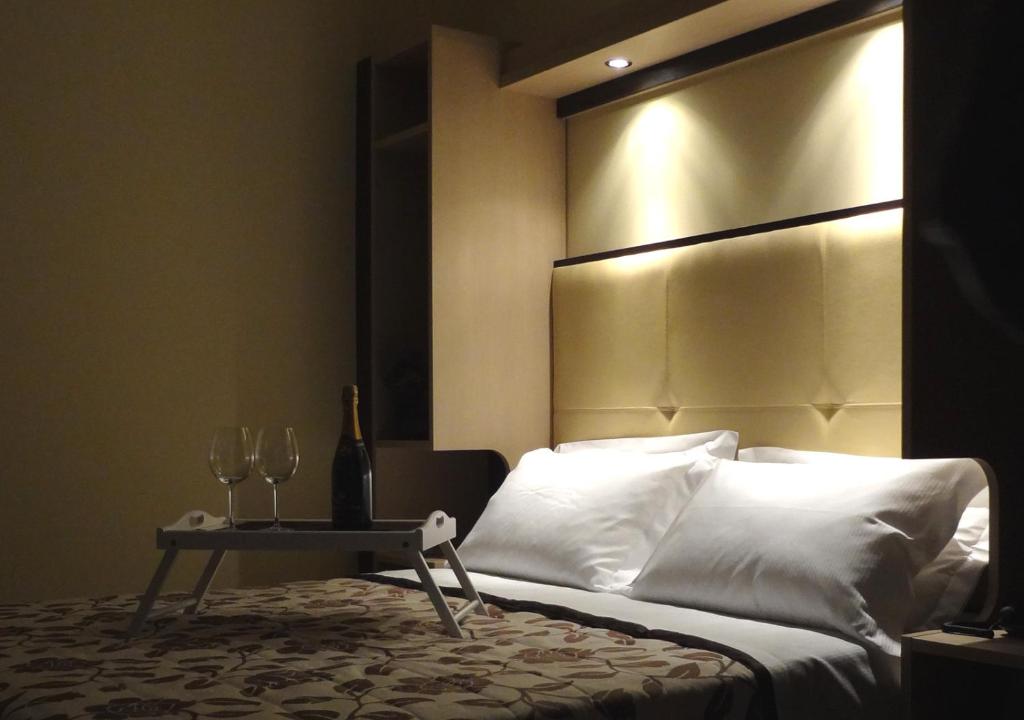 Postel nebo postele na pokoji v ubytování Hotel Alverì