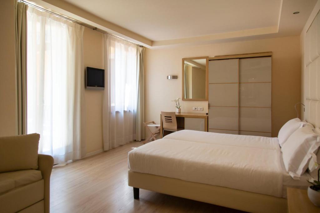 Postel nebo postele na pokoji v ubytování Hotel Antico Borgo