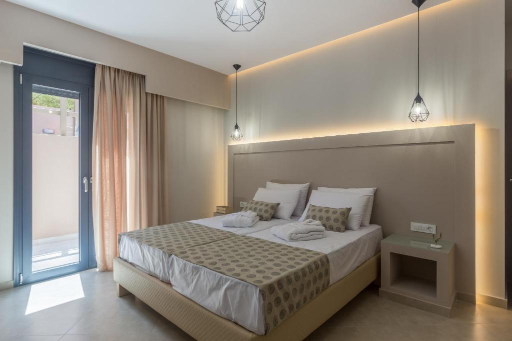 Postel nebo postele na pokoji v ubytování Amelia Residence