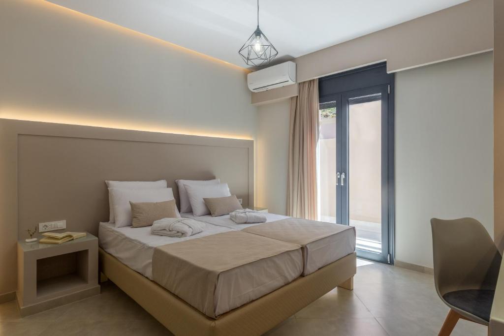 Postel nebo postele na pokoji v ubytování Amelia Residence