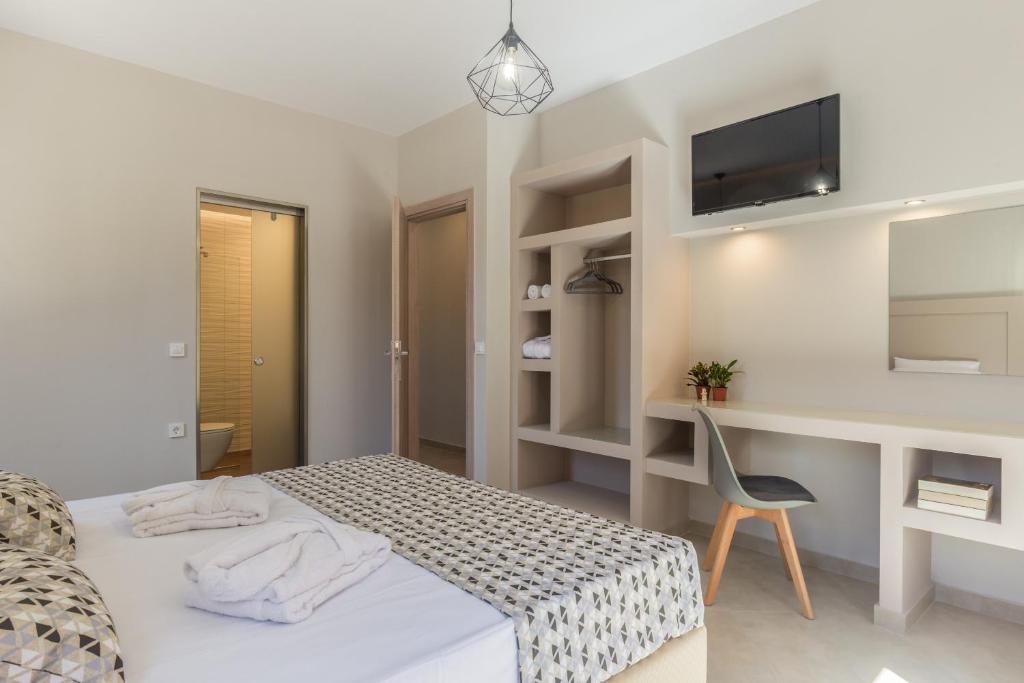 Postel nebo postele na pokoji v ubytování Amelia Residence