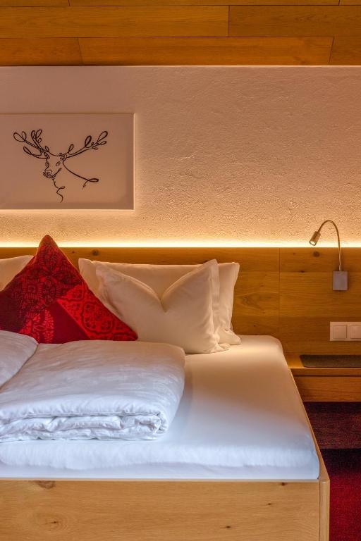 Postel nebo postele na pokoji v ubytování Pension Christophorus Hotel Garni