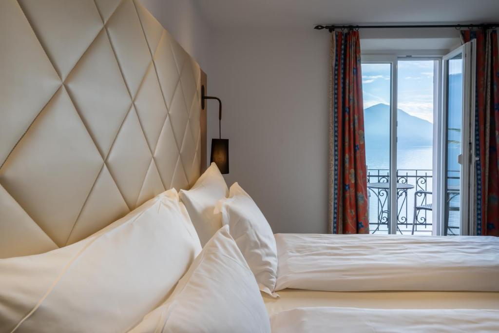 Postel nebo postele na pokoji v ubytování Hotel Collinetta