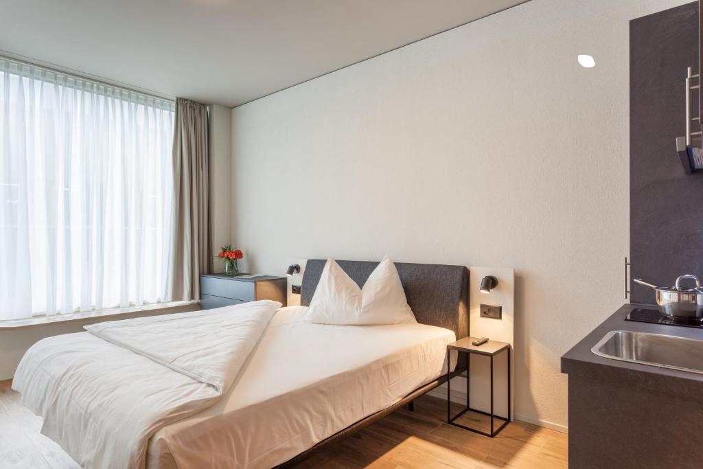 Postel nebo postele na pokoji v ubytování Centurion Swiss Quality Towerhotel Windisch