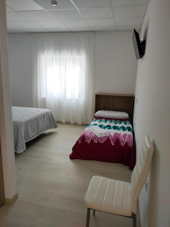 Postel nebo postele na pokoji v ubytování Las Huertas