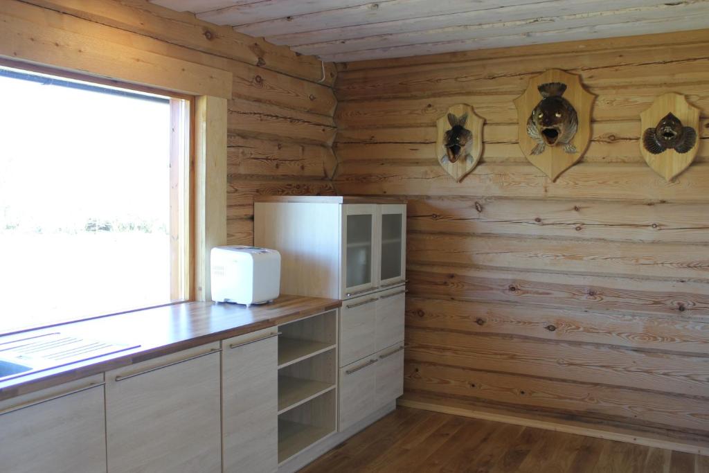 Kuchyň nebo kuchyňský kout v ubytování Rootsimaa Holiday House